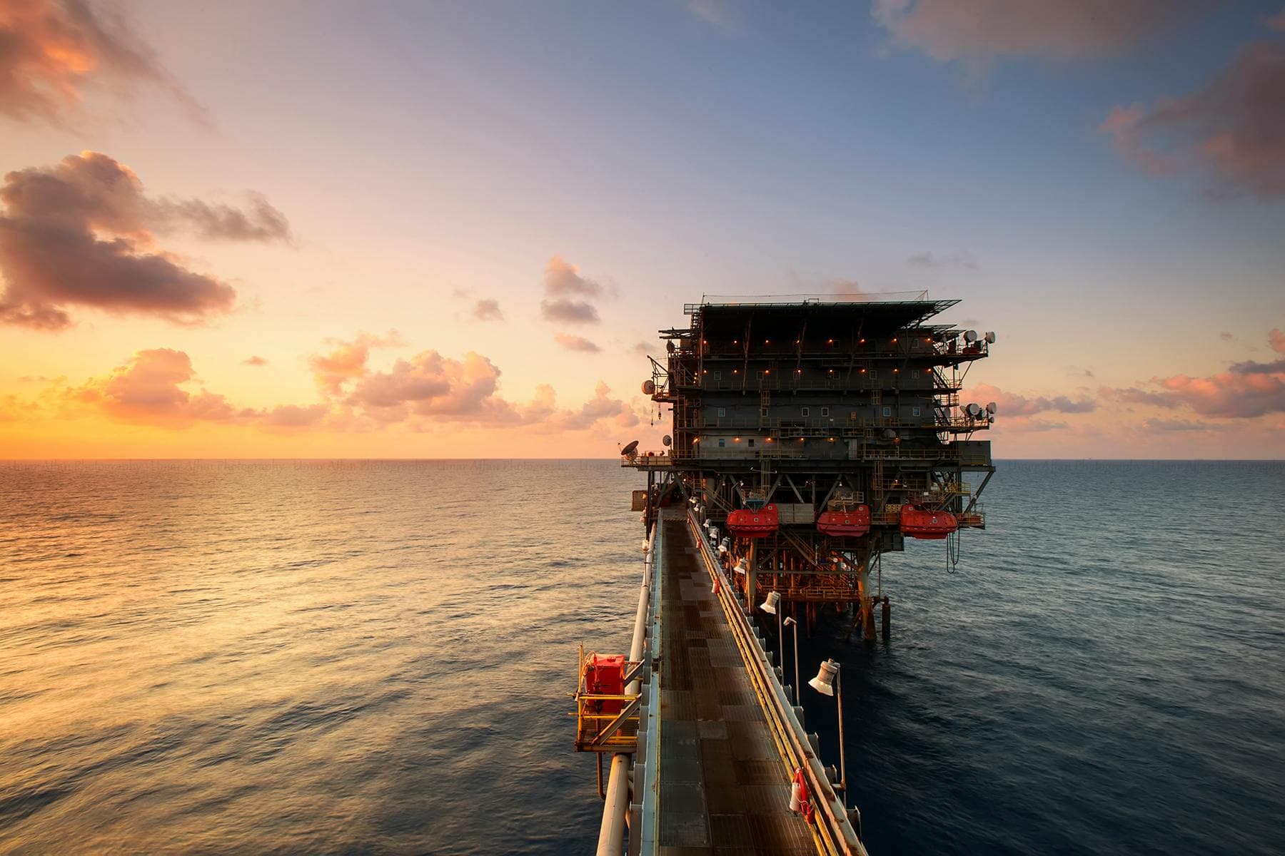 Oil rig at sunset
